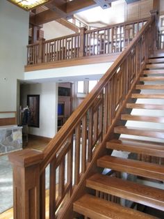 a wooden stair case in a large room