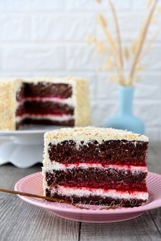 a slice of red, white and blue cake on a pink plate