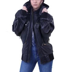 Shop now and elevate your style with our women's black leather hooded jacket. crafted with premium leather, this jacket features a sleek design, multiple pockets, and a convenient zipper closure. stay fashionable and organized with this versatile wardrobe staple. Punk Woman, Punk Women, Gloves Fashion, Leather Jacket With Hood, Versatile Wardrobe, Leather Skin, Black Leather Jacket, Elevate Your Style, Outerwear Women