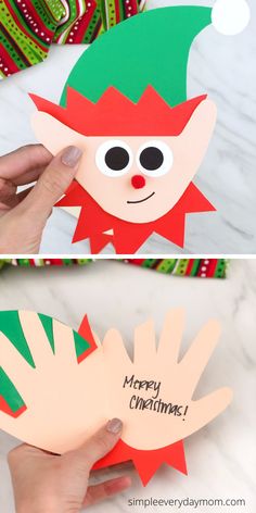 someone is holding up a christmas card to make it look like the elf with his hands