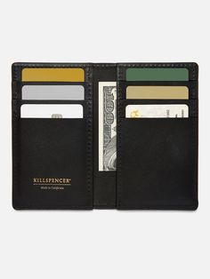 MADE IN U.S.A.: The Vertical Card Wallet features six card slots for carrying your credit cards and ID's. It also features two open inside pockets perfect for storing cash, cards, and more. - Premium bullhide leather- Stitched and hand-painted edges- Stamped with our KILLSPENCER logo in gold foil 3.2" X 5.2" X.7" WEIGHT: Approximately .1 lbs cove Leather Business Card Holder With Interior Slots, Black Trifold Card Holder With Interior Slots, Black Bifold Wallet With Interior Card Slots, Leather Wallets With Card Slots For Business, Black Trifold Wallet With Card Slots For Business, Black Bifold Card Holder With Phone Sleeve, Black Bifold Card Holder, Black Trifold Wallet With Interior Card Slots For Business, Black Trifold Wallet For Business With Card Slots