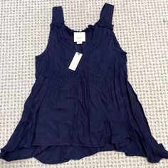 Anthropologie Maeve Tank Color- Navy (The First Photo Is Most Accurate) Size - Small Condition- Nwt, Never Worn Asymmetrical Boots Hem, Flowy Fit, Ruffle Details 100% Rayon Navy Sleeveless Top For Vacation, Navy Sleeveless Top For Day Out, Navy Tank Top For Spring, Velvet Sweatshirt, Boho Tunic Tops, Embellished Sweaters, Dolman Sleeve Tops, Boho Tunics, Anthropologie Top