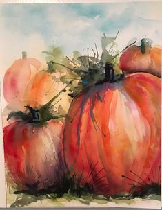 a watercolor painting of pumpkins on a table