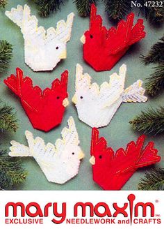 four red and white birds are hanging from a christmas tree with the words mary maxm on it