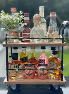 decorated mini Bar cart for a $5 target cart Liquor Auction Basket Ideas, Booze Table Ideas, Mini Bar Gift Basket, Tequila Bottle Gift Ideas, Liquor Bottle Gift Box Ideas, Liquor Goodie Bags, Alcohol Gift Basket Ideas Christmas, Alcohol Theme Gift Basket, Patron Gift Ideas