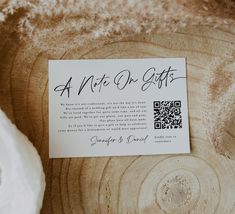 a note on gifts sitting on top of a wooden table next to a white piece of paper