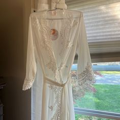 Size Small, Never Worn Too Big For Me. Still Has Tags Attached Perfect For Wedding Day Getting Ready Robe With Lace Delicate Lace For Wedding Night, Fitted Feminine Robe With Lace Trim, Feminine Fitted Robe With Lace Trim, Fitted Lace Robe With Sheer Details, Fitted Lace Robe With Lace Trim, Fitted Sheer Lace Robe, White Feminine Fitted Robe, Elegant Summer Robe With Lace Trim, Fitted Sheer White Robe