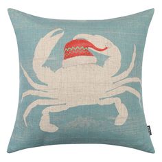 a crab pillow with a santa hat on it