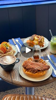 a table topped with plates of food and drinks