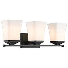 three light bathroom fixture with frosted glass shades and black metal frame, on an isolated white background