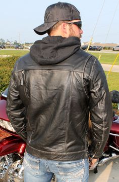 Men's jean style leather jacket with a vintage hand rubbed finish, removable hood, venting, concealed carry pockets and more. A hood men's black leather jacket that is antiqued to make it look well loved. A men's black jacket with zip off hood, zip out lining and made of premium soft cowhide leather. This jacket comes with dual inside hidden concealed carry pockets with barrel loops to hold it in place, mandarin collar, a snap up front flap hiding a heavy duty YKK zipper, two snap down chest pockets, two front zipper belly pockets, soft zip out lining, zip cuffs to keep the wind out, zip sides for sitting comfort, and classic jean jacket styling. This jacket comes with a special unique vintage, rubbed finish. Sizes: M, L, XL, 2X, 3X, 4X, 5X. +$10 for 2X-3X, +$20 for 4X-5X. [6#] zip off hoo Fitted Black Biker Hooded Jacket, Fitted Biker Jacket With Double-lined Hood, Black Biker Hooded Jacket, Hooded Biker Leather Jacket With Pockets, Style Leather Jacket, Mens Black Jacket, Mens Fashion Jeans, Leather Travel Bag, Leather Hats