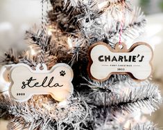 personalized dog ornament hanging from a christmas tree with silver tinsel on it