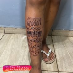 a woman's legs with tattoos on them and the words written in cursive writing