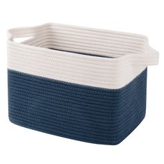 a blue and white storage basket with handles