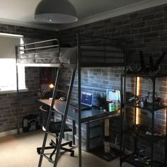 a loft bed sitting next to a desk in a bedroom