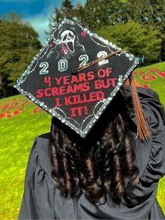 a woman wearing a graduation cap with the words 20 years of screams but i killed it