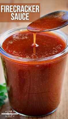 a spoon full of barbecue sauce being poured into a jar with the words, how to make firecracker sauce