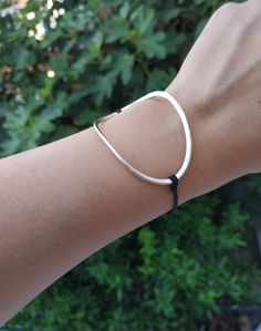 I love it's simple and unique design!  It is minimal, lightweighted and really comfortable to wear all day! I guarantee that you wouldn't want to take it of your hand! You can have it with a silver or golden finish. A piece of thick sterling silver wire was hammered until it gave me this lovely freeform bracelet! It is perfect for summer because it is very elegant and you can combine it with other bracelets too! You can also wear it in the water without fear!!  This handmade unique jewel is idea Everyday Metal Bracelets With Sliding Knot, Trendy Silver Jewelry With Sliding Knot, Modern Silver Friendship Bracelets, Adjustable Sterling Silver Chain Bracelet, Trendy Silver Bracelet With Sliding Knot, Modern Sterling Silver Friendship Bracelets, Trendy Silver Adjustable Bracelet, Adjustable Sterling Silver Bangle For Everyday, Adjustable Everyday Sterling Silver Bangle Bracelet