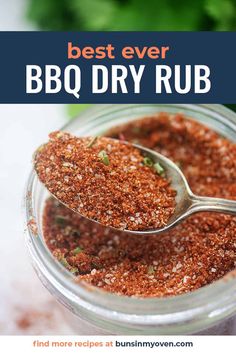 the best ever bbq dry rub recipe in a glass jar with a spoon inside