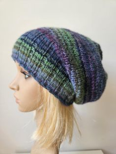 Original, slouchy hand knitted hat.  Handmade of soft muliticolored  yarn: wool and acrylic yarn 53/47%.  Very comfortable, size: stretchy, best for 54-58 cm (21-22 inch) head. The exact position of color stripes may vary a bit, as it is made of multicolor yarn. The waiting time is 1-3 days plus delivery time after the purchase. I always try to complete the project as soon as possible, so it may be shorter :-) Slouchy Knit Beanie One Size, Knitted Beanie One Size, Slouchy Knit Beanie, Slouchy Soft Knit Beanie, Slouchy Acrylic Yarn Beanie, Casual Style, Casual One Size Acrylic Bonnet, Soft Knit Acrylic Beanie, One Size Fits Most, One Size Soft Knit Acrylic Beanie, One Size Acrylic Beanie Bonnet