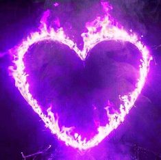 a purple heart with flames in the middle