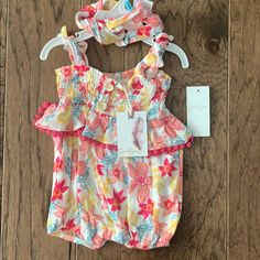 Brand New With Tags Jessica Simpson Baby Romper. Size 3-6 Months, 24-27”, 12.5-17 Lbs. Features A Beautiful Spring/Summer Floral Print, Wooden False Buttons On Front, Tie Straps, Ruffle/Pom Pom Ruffle, And A 3 Snap Closure On Bottom. Comes With A Matching Headband. No Rips Or Stains. Feel Free To Ask Questions! Playful Bubble Romper For Beach In Spring, Playful Spring Beach Bubble Romper, Playful Bubble Romper For Spring Vacation, Playful Bubble Romper For Vacation In Spring, Fun Summer Playwear For Babies, Yellow Cotton Bubble Romper For Summer, Summer Yellow Cotton Bubble Romper, Yellow Cotton Summer Bubble Romper, Casual Yellow Bubble Romper For Summer