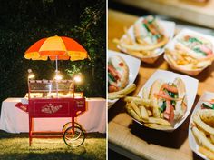 an assortment of food is displayed on plates next to a cart with fries and hotdogs