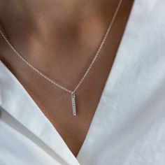 A petite version of our best selling Mini Bar Necklace. Add a little sparkle with our diamond dusted option or up the ante with a diamond set in the pendant. We love adding a mini bar and petite bar pendants to one chain for an extra personal touch. details+ petite bar pendant measures 5/8" long+ add a brilliant 1.5mm diamond option+ on model : 16 & 18" adjustable necklace+ s hook closure+ handmade with love in our Georgia studio availability handmade to order. ships in 5 - 14 days.current produ Sterling Silver Bar Necklace For Everyday, Silver Sterling Bar Necklace For Anniversary, Minimalist Sterling Silver Bar Necklace For Anniversary, Everyday Minimalist Sterling Silver Birthstone Necklace, Silver Dainty Bar Necklace For Everyday, Dainty Sterling Silver Bar Necklace For Everyday, Dainty Sterling Silver Bar Necklace, Dainty Silver Bar Necklace Gift, Dainty Rectangular Pendant Bar Necklace For Everyday