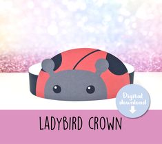 the ladybird crown is made out of paper and has a pink background with sparkles