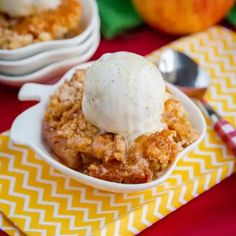 an apple crisp with ice cream in a bowl