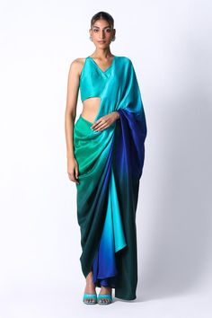 Emerald green and blue silk pre draped saree in an ombre base. Comes with tasselled back blouse.
Components: 2
Pattern: Ombre,Embellished
Type Of Work: Sequin
Neckline: V-neck
Sleeve Type: Sleeveless
Fabric: Silk
Color: Emerald Green,Blue
Other Details: 
Built in petticoat
Closure: Saree: Front button
Occasion: Cocktail,Reception - Aza Fashions Blue Green Saree, Pre Draped Saree, Ombre Saree, Dress Code Guide, Green Silk Saree, Combination Dresses, Draped Saree, Sarees For Girls, Colour Combinations Fashion