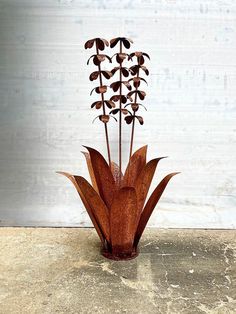 a vase with flowers in it sitting on a table