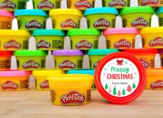 play - doh's christmas ice cream is on display in front of many colorful cups