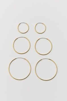 Set of three pairs of classic hoop earrings in 18k gold-plated or sterling silver-plated finishes. Endless hoop closure. Content + Care. Set of 3 pairs 80% Brass, 15% stainless steel,\u00a05% real gold or silver plating\u00a0\u00a0 Avoid contact with water Imported Size. Dimensions: 1.5" , 1.25" , 0.75" \u00a0dia Urban Outfitters Hoop Jewelry, Elegant Everyday Jewelry By Urban Outfitters, Elegant Everyday Jewelry From Urban Outfitters, Elegant Gold Jewelry From Urban Outfitters, Elegant Gold Urban Outfitters Jewelry, Urban Outfitters Gold Jewelry For Gift, Urban Outfitters Gold Jewelry For Gifts, Hoop Earring Set, Hoop Earring Sets