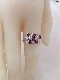 18K White Gold Ruby And Diamond Ring 6 Brilliant Cut AA quality Rubies 1ctw 8 Genuine Diamonds .88ctw SI2 clarity F Color Appraisal $8,000 Beautiful High Diamonds F color grade Rubies AA quality Gorgeous 18K Gold Ring Weighs- 5.2 grams Ring size - 7.25 Visit our shops on Etsy HauteCoutureLaLa TrendsCouture BeautifulPatina LastingTrends Combine shipping within the first three shops listedFree Shipping on orders over $35.00 however if there is a return buyer to refund seller for the free shipping Cluster Diamond Ruby Ring In White Gold, Ruby Ring With Diamond Cluster And Brilliant Cut, Cluster Ruby Ring With Brilliant Cut Diamonds, White Gold Cluster Ruby Ring With Diamonds, Cluster Diamond Ring With Vvs Clarity And Ruby, Cluster Ruby Ring In White Gold For Wedding, White Gold Cluster Ruby Ring For Wedding, Classic Multi-stone Cluster Ruby Ring, Classic Multi-stone Cluster Diamond Ring