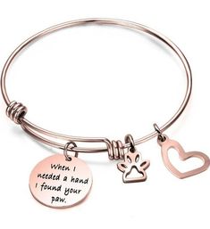 This sale is for one (1) Inspirational ~ Stainless Steel Bracelet Hypoallergenic Bangle bracelet with a charm that says "when I needed a hand I found your paw" ~ a heart charm & a paw charm Rose Gold in color with black lettering Adjustable bracelet ~ fits most adult wrists Squeeze to open it and slide over your hand & wrist - slide the center adjustable section outward to tighten High quality ~ made from durable and long lasting stainless steel Bracelet comes in a fabric ~ drawstring sack/bag This bracelet is brand new ~ never worn Please view photos for a good description of this bracelet Thank you! Bracelet Rose Gold, Hand Wrist, Inspirational Bracelets, Sack Bag, I Found You, Bracelets And Charms, Adjustable Bracelet, Steel Bracelet, Stainless Steel Bracelet