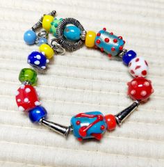 Colorful chunky glass bead and silver bracelet. Chunky Bracelet, Chunky Bracelets, Glass Bracelet, Glass Bead, Colored Glass, Glass Beads, Silver Bracelet, Jewelry Bracelets, Accessory Gift