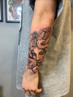 a person with a tattoo on their arm