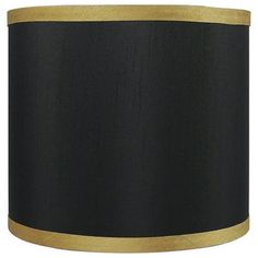 a black and gold lamp shade on a white background