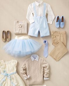 a collection of children's clothing and shoes