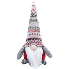 a stuffed animal wearing a knitted hat and scarf with a long beard, sitting on top of a white surface