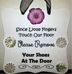 a sign that says, since little fingers touch our floor please remove your shoes at the door