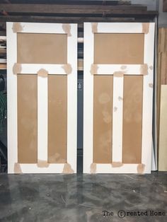 two doors are being painted in the process of being installed on top of a table