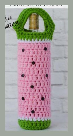 a crocheted watermelon bottle cover is shown in pink, green and white