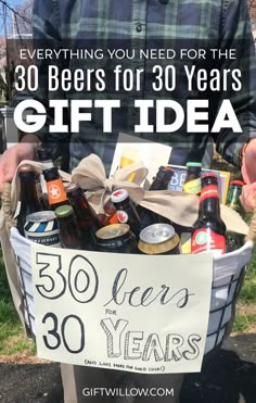 a man is holding a basket full of beer and sodas with the words, everything you need for the 30 beers for 30 years gift idea