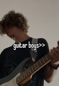 a man with curly hair playing an electric guitar and texting the word guitar boys