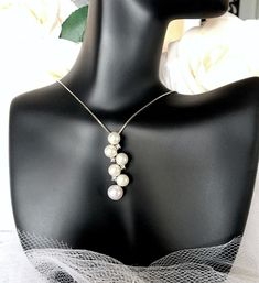 Very unique, this natural pearl necklace adds a classy look that makes an elegant and feminine statement. The pendant is set in 925 sterling silver (marked) and it features excellent quality freshwater pearls surrounded by high grade cubic zirconia in an intricate, eye-catching design. The sterling silver has been rhodium dipped for a bright finish, which perfectly enhances the intricate detailing and makes it tarnish resistant. The pendant is about 1.5" (approx. 3.8cm) long by 0.3" (approx. 0.8 Pearl Wedding Jewelry, Natural Pearl Necklace, Pearl Jewelry Wedding, Silver Box, Natural Pearl, Pearl Wedding, Elegant Necklaces, Bridal Necklace, How To Look Classy