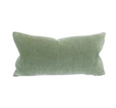 a green pillow on a white background