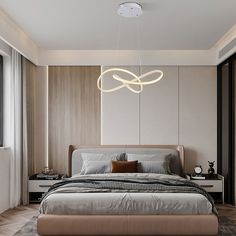 a bedroom with a bed, nightstands and lamps hanging from the ceiling above it