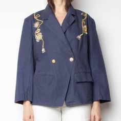 unique 80s blazer with notched hem and gold and silver tassel embroidery. beautiful navy ramie/cotton fabric with a linen hand feel. unlined. cute fit. Size: labeled 11/12 - fits S-M Label: appraisal Bust: 39" Waist: 37" Hips: 40" Shoulder width: 17" Length: 27.5" Sleeve length (from center back neck): Content: 55% ramie 45% cotton Condition: excellent vintage Spring Navy Cotton Blazer, Navy Cotton Blazer For Spring, Tassel Embroidery, 80s Blazer, Cute Fit, Gold And Silver, Women's Blazer, Nautical, Suit Jacket